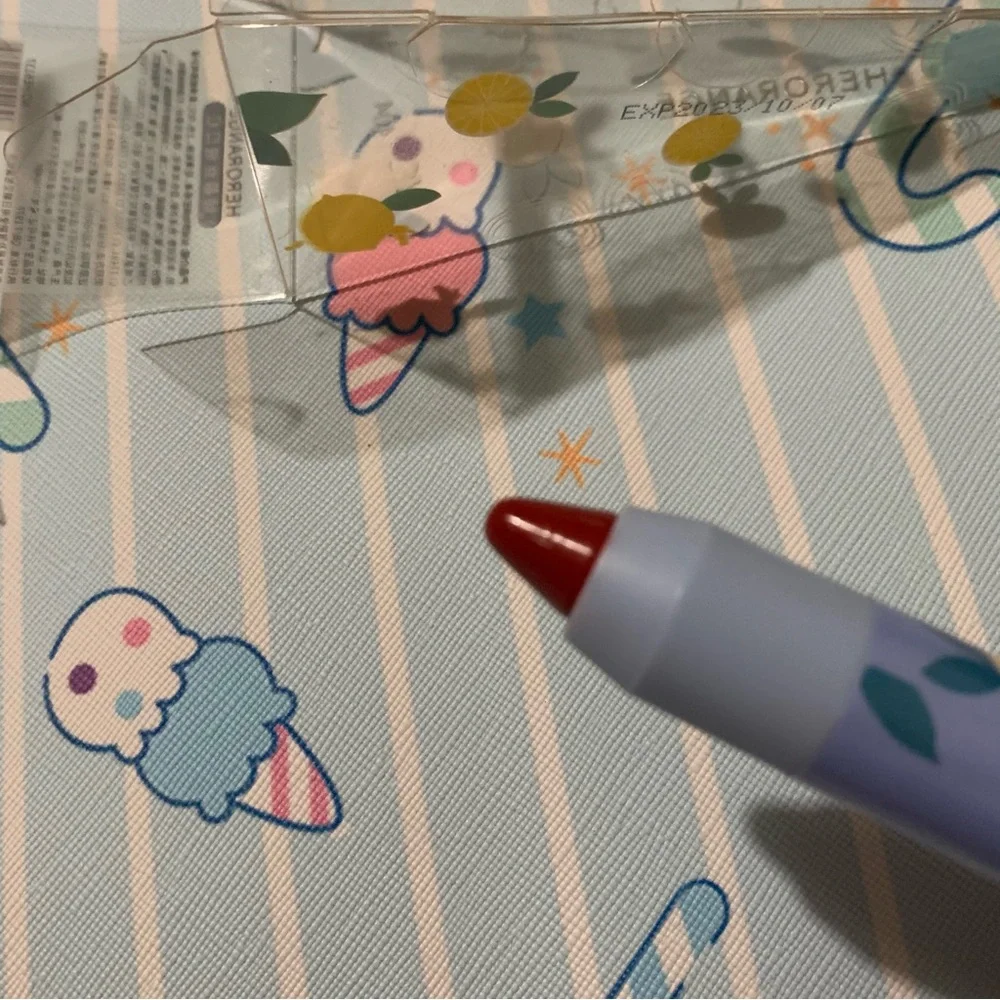 Red Twist-Up Lip Crayon in Triangle Packaging with Hang String